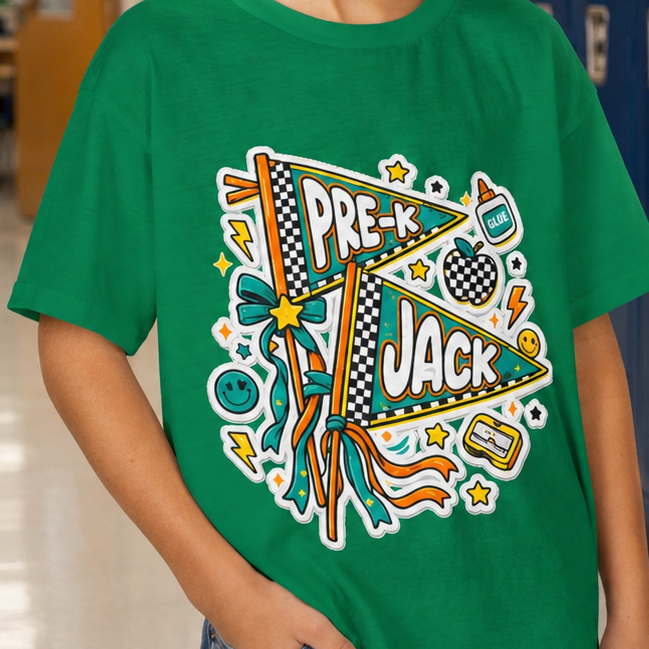 A young boy wearing a green graphic t-shirt with a 'PRE-K JACK' sports design, standing in a school hallway with blue lockers behind him.