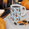 Mug with 'best dad ever' text and children's faces, surrounded by Halloween-themed treats and pumpkins.
