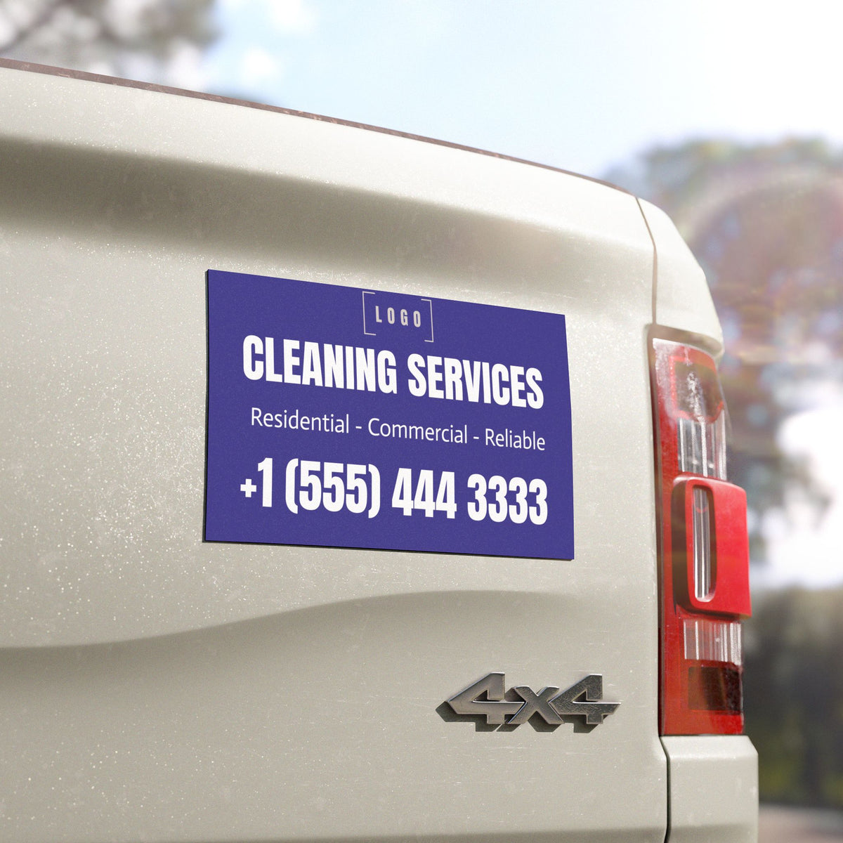 Rectangle car magnet on a truck tailgate, close-up view showing the vinyl print detail