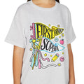 A young girl smiling while wearing a light gray heather t-shirt with a colorful 'First Banana Sophia' graphic on the front, paired with khaki cargo pants, against a plain white background.