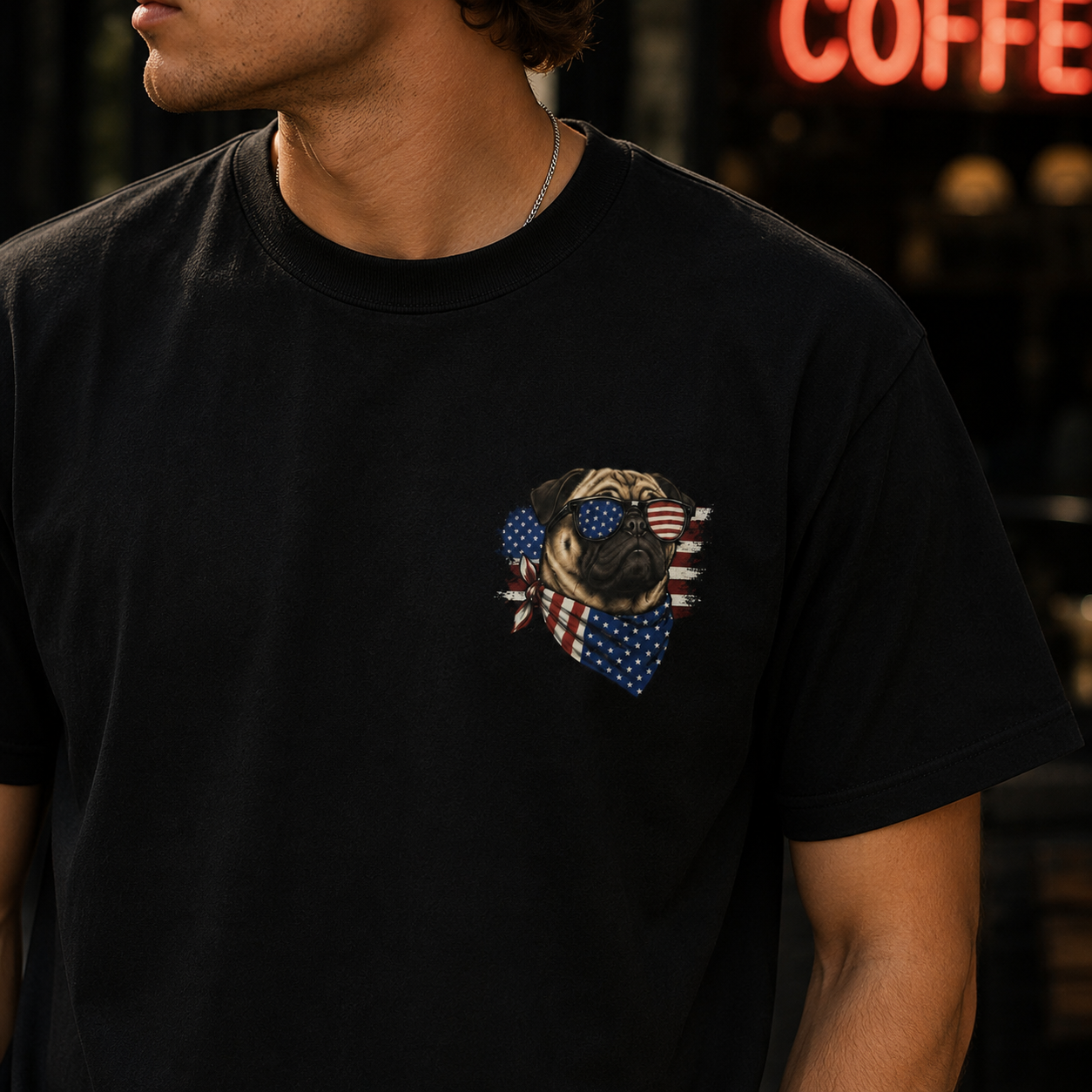 Person wearing a black t-shirt with a pug design featuring American flags.
