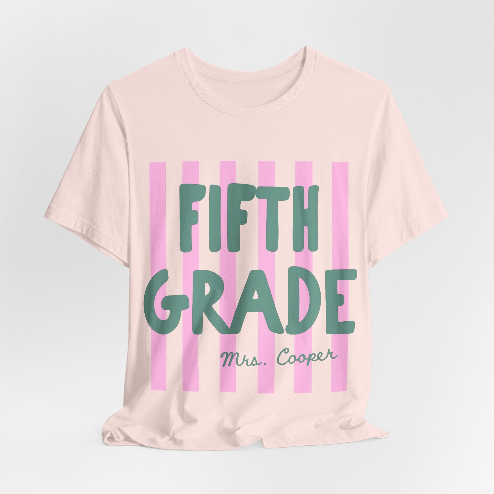 Cream personalized striped teacher tee with custom grade and name text in green