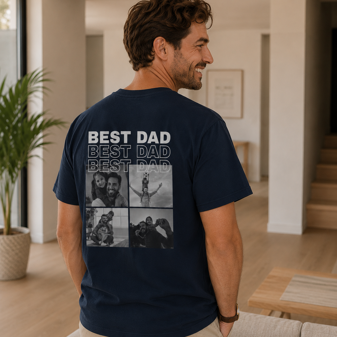 Man wearing a navy blue t-shirt with 'BEST DAD' text and photo collage in a living room.