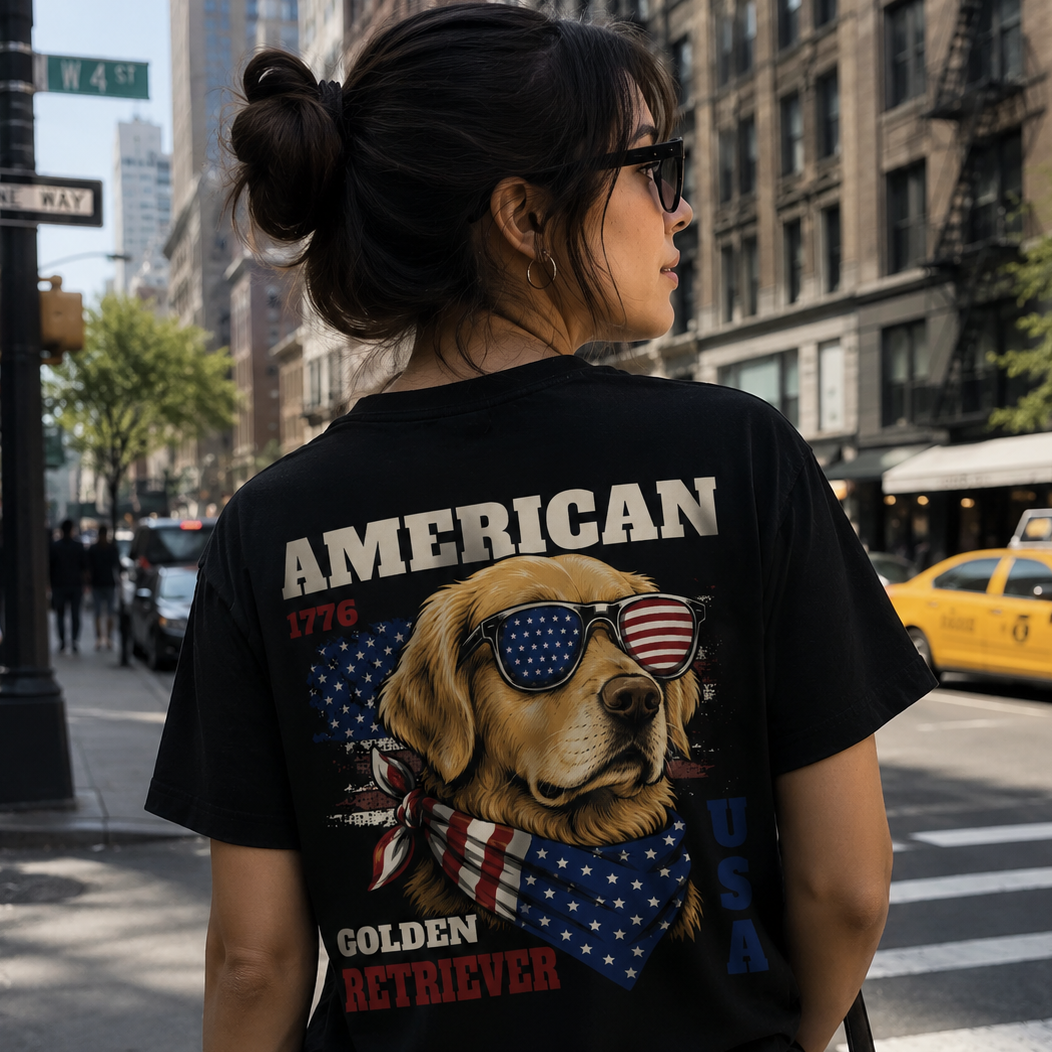 Person wearing a black t-shirt with a dog graphic and 'American Golden Retriever' text on a city street.