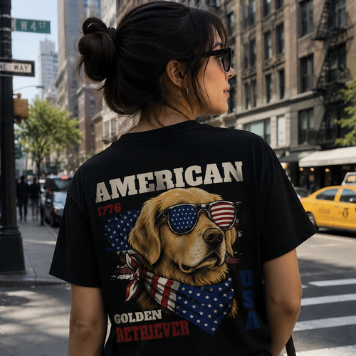 Person wearing a black t-shirt with a dog graphic and 'American Golden Retriever' text on a city street.