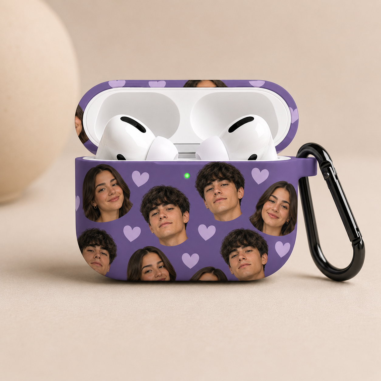 Purple AirPods case with multiple faces and hearts on a beige background