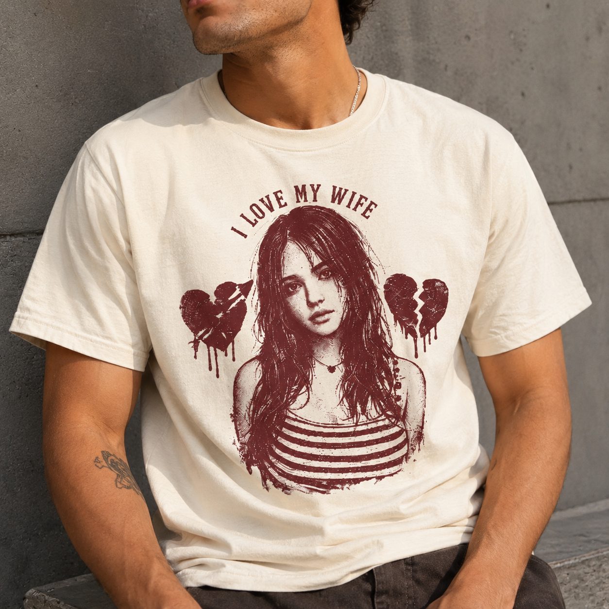 Person wearing a natural t-shirt with a graphic design of a woman and text 'I Love My Wife'.