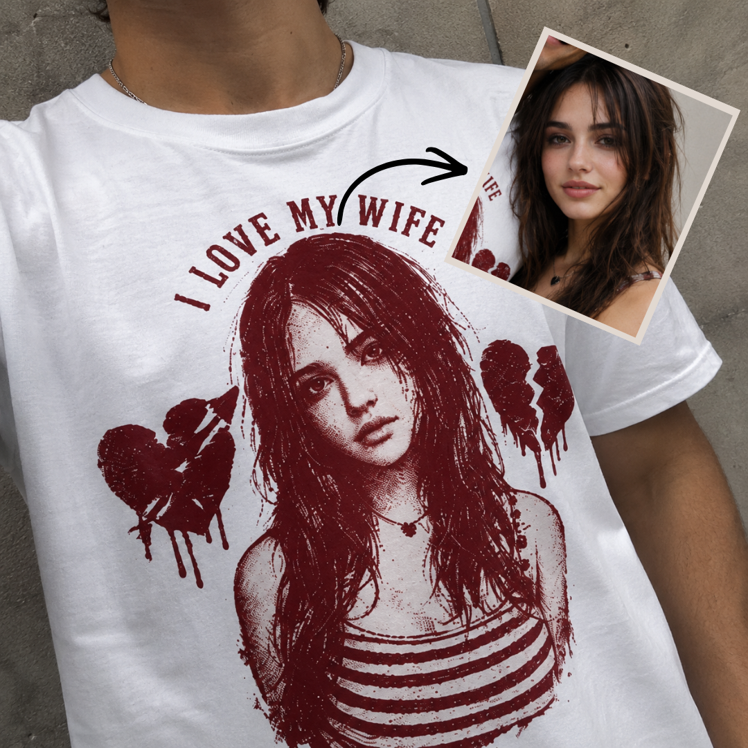 White t-shirt with graphic design of a woman and text 'I Love My Wife' on a concrete surface.