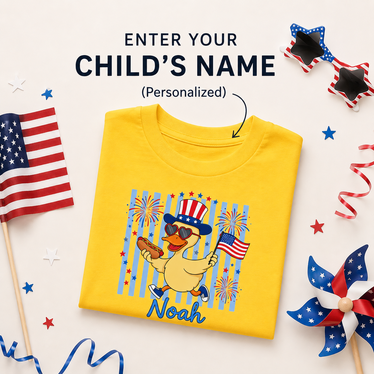 Yellow t-shirt with a duck wearing an American flag hat and sunglasses, surrounded by patriotic decorations.